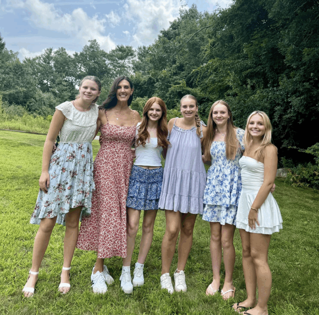 Maria posing with teens at Fearless Focus summer camps for girls. 